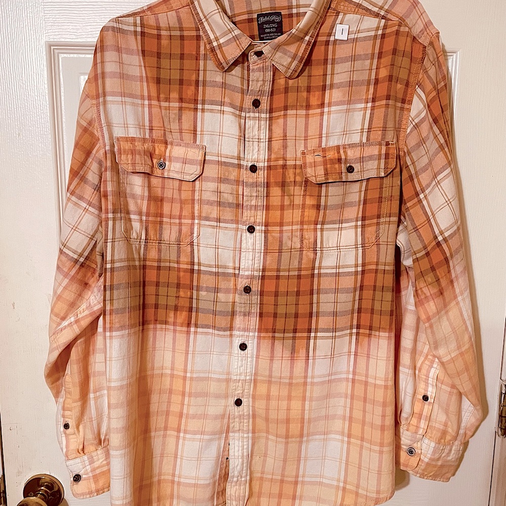 This is a one of a kind bleached flannel shirt. It gives you that rancher look.